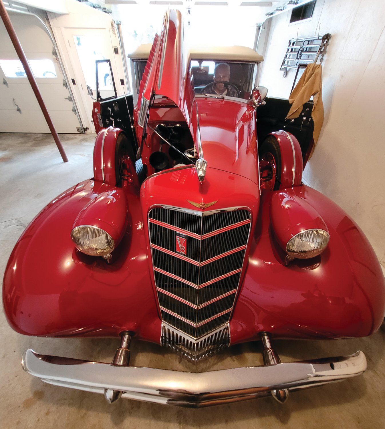 TIME TO CRUISE: John Ricci takes a seat behind the wheel of his 1934 Cadillac. This weekend, he’ll be driving the car that he restored to Newport to compete in the Concours d’Elegance.